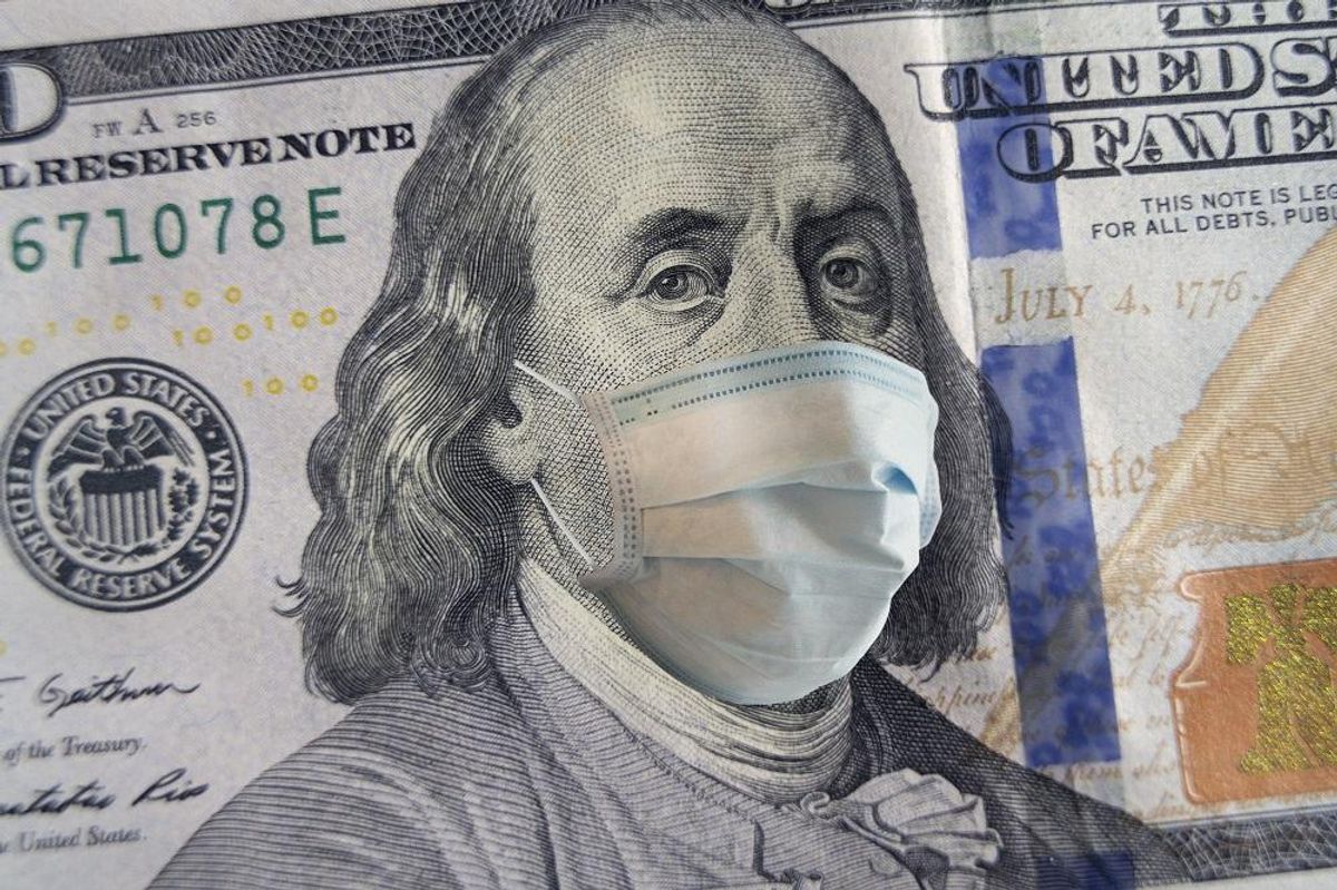100 dollar banknote with a face mask. World crisis