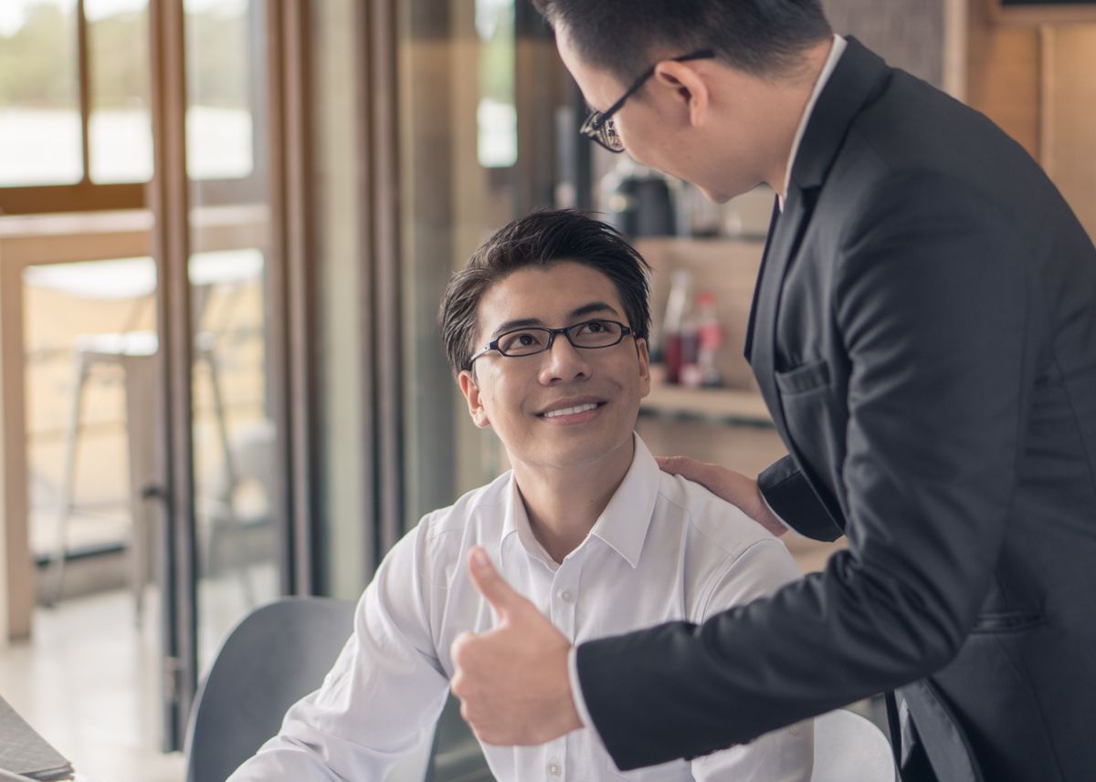 A boss encouraging and trusting his employee