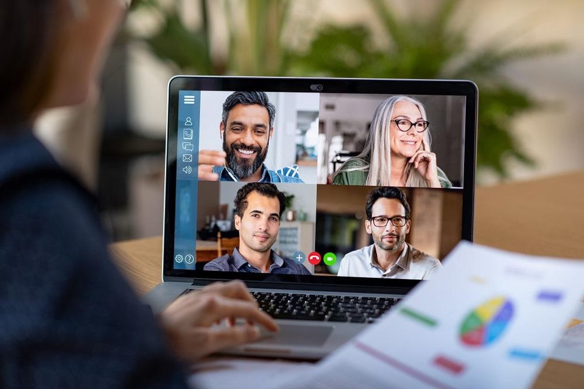 A hybrid workplace with employees on a video conference call