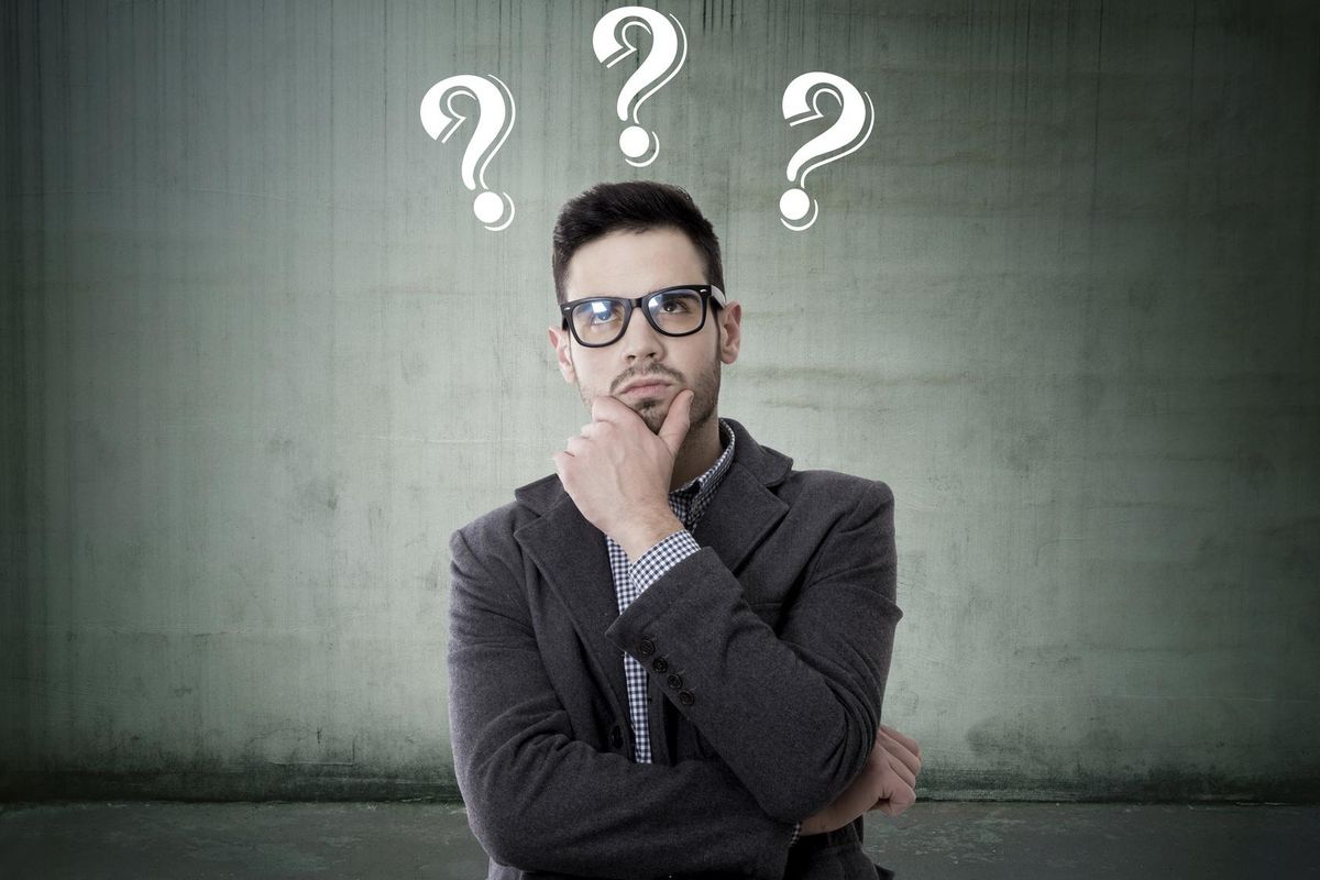 A man ponders the best ways to gather company information.