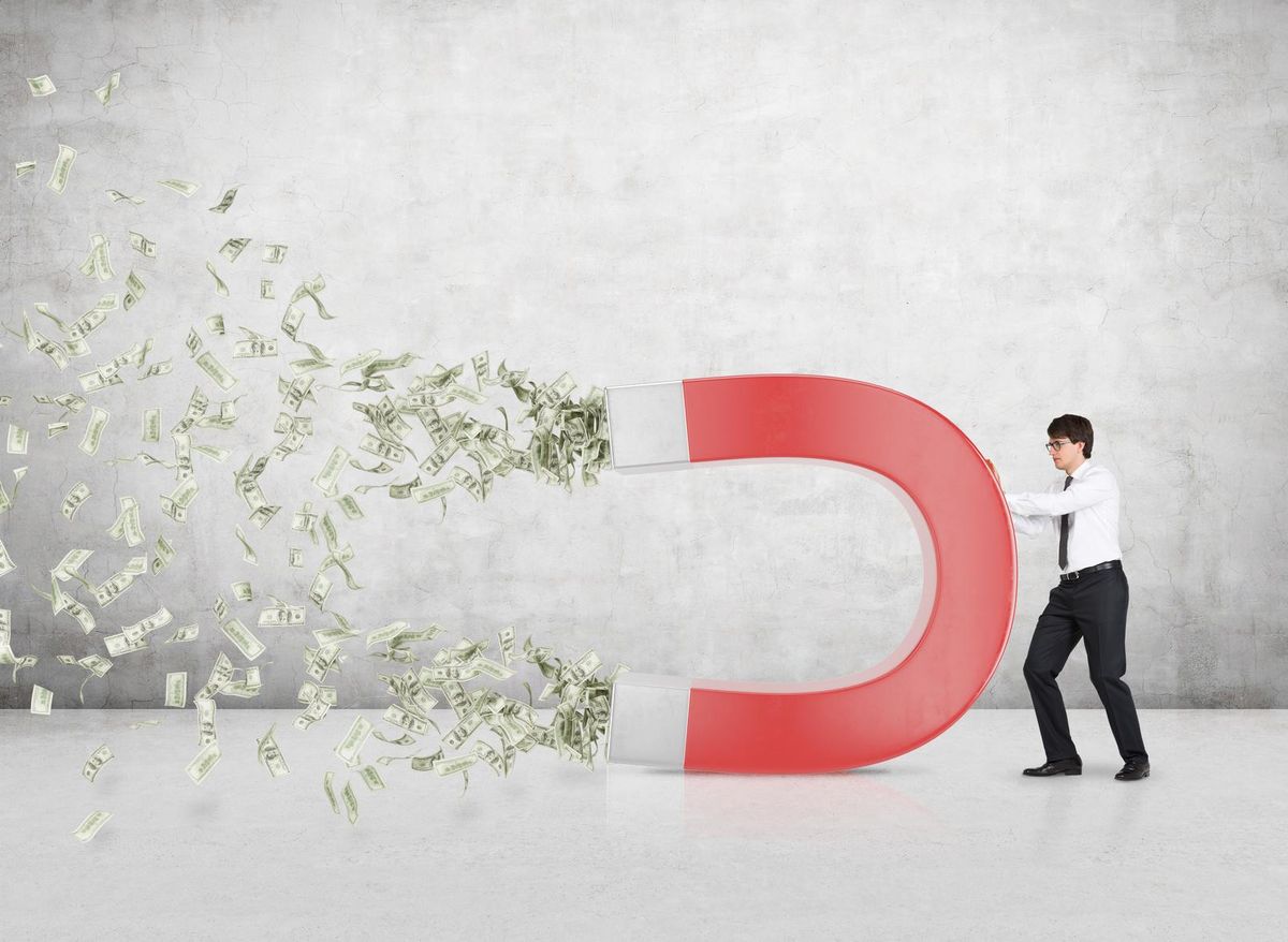 businessman attracts money