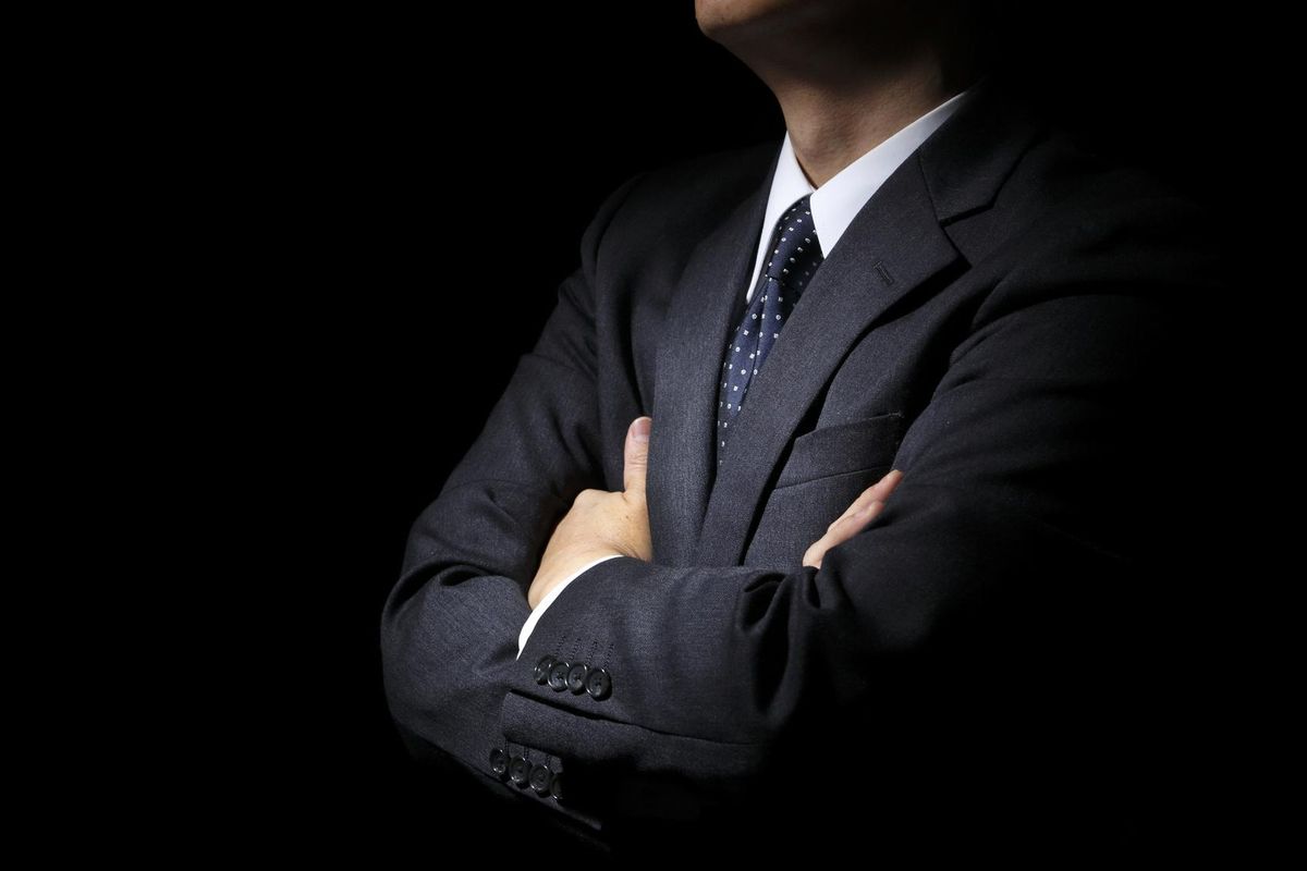 Businessman with arms folded