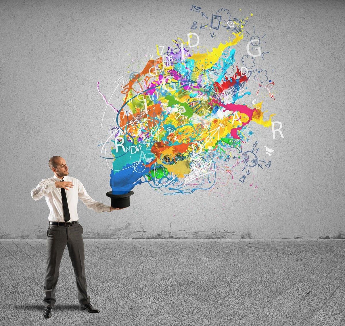 Creative businessman with colors coming out of the hat