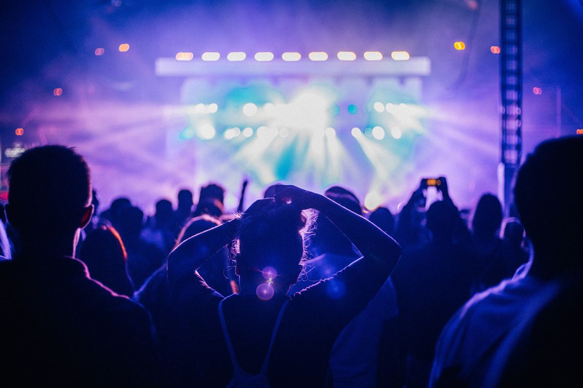 Female singer performing on stage at a concert