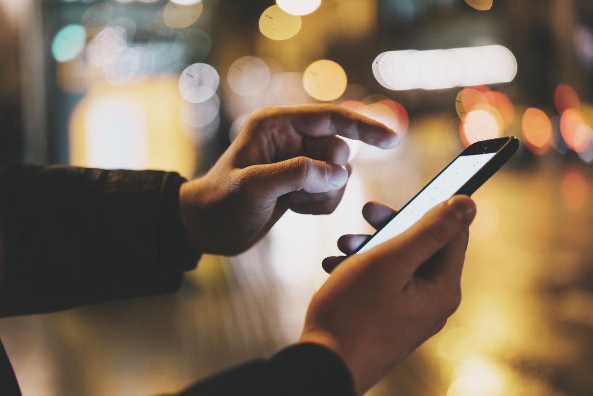 male hands using modern smartphone