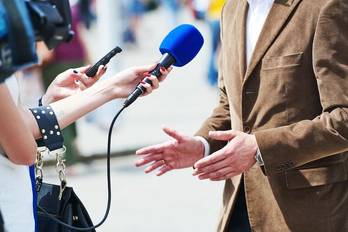media reporter with microphone