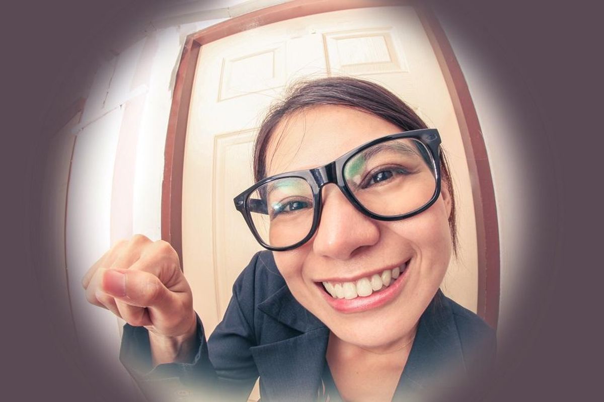 Saleswoman knocking on door