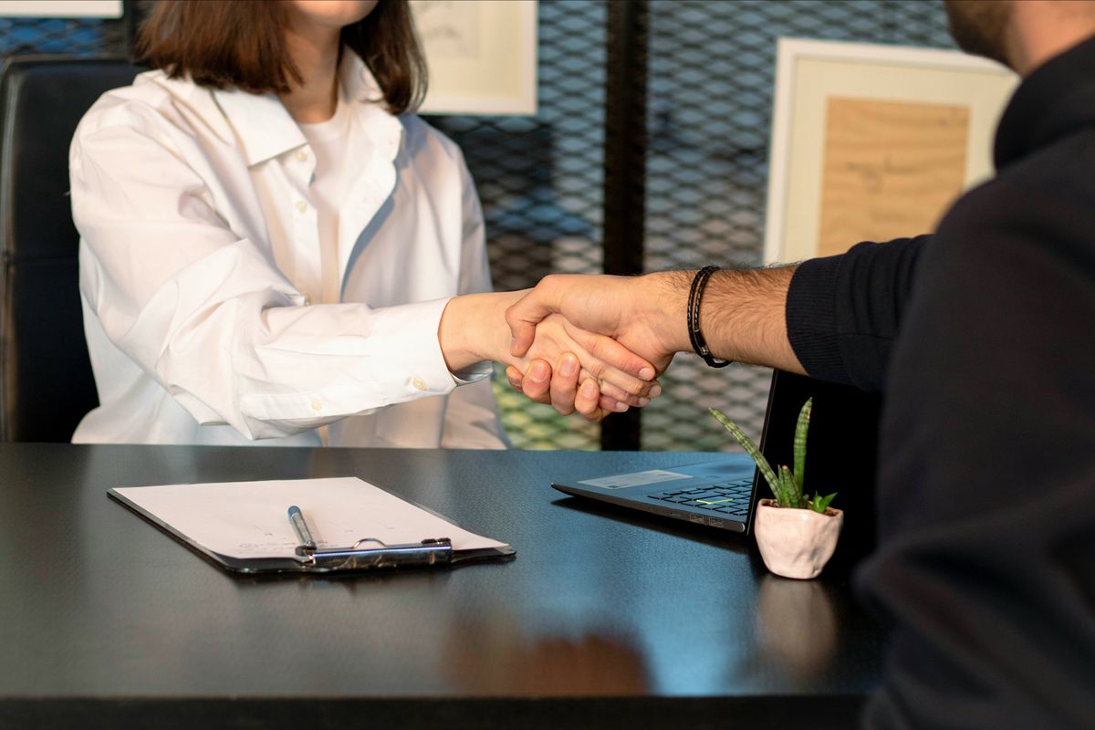 Shaking hands on a contract with a client