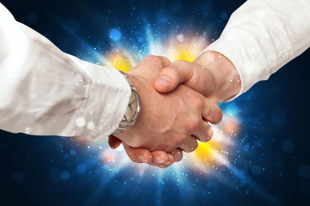 Two business men shaking hands