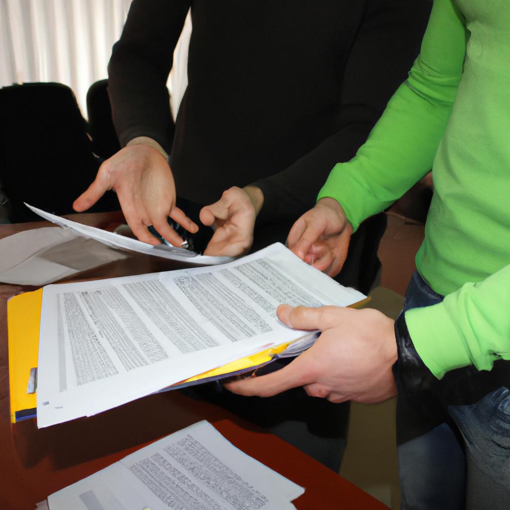 Person holding financial documents, discussing